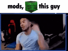 a man in a white shirt is standing in front of a green cube that says mods