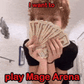 a person is holding a fan of money in front of their face and says i want to play mage arena