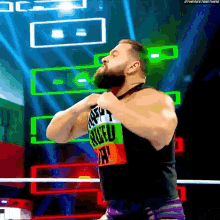 a man with a beard is wearing a shirt that says rude