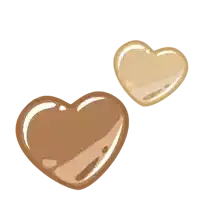 a brown heart and a tan heart are floating in the air