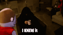 a person sitting on a couch holding a cup of coffee with the words " i knew it " on the bottom