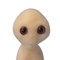a stuffed animal with purple eyes looks like an alien
