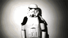 a storm trooper from star wars stands in front of a white wall