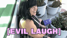 a woman sitting in front of potted plants with the words evil laugh written on the bottom