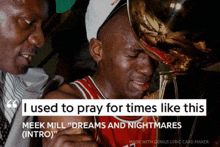 a basketball player is crying while holding a trophy