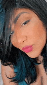 a close up of a woman 's face with pink lips