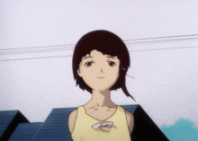 a girl in a yellow tank top with a pink bow