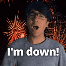 a man with glasses and a ferris wheel behind him says i 'm down