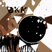 a group of people standing in front of a black circle with the word bkk written on it