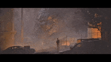 a man stands in front of a large monster in a city