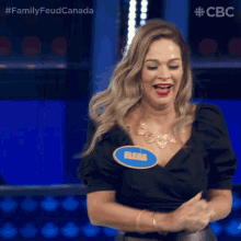 a woman wearing a name tag that says elena