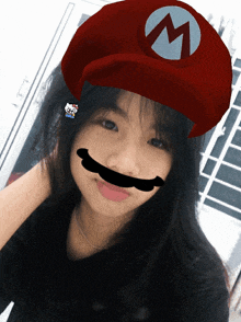 a girl wearing a mario hat and a hello kitty earring