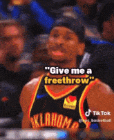 a basketball player in an oklahoma jersey says give me a freethrow