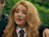 a girl in a school uniform with a discord logo in the corner