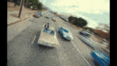 a blurry picture of two cars driving down the road