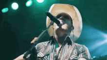 Singing Cowboy Hat GIF - Singing Cowboy Hat On Stage GIFs