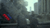 a blurred image of a man standing in front of a giant robot