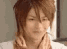 a close up of a person 's face with a blurred background .