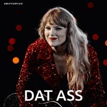 a woman in a red sequined jacket is holding a guitar and the word dat ass is on the bottom