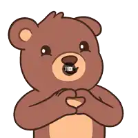 a teddy bear making a heart shape with its hands