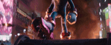 sonic the hedgehog is standing on a ledge in a city at night .