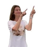 a woman wearing a white t-shirt with a picture of a flower on it