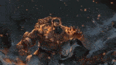 a man with a beard is surrounded by flames in a video game