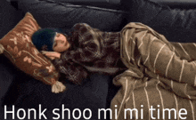 a person laying on a couch with the words honk shoo mi mi time written on the bottom