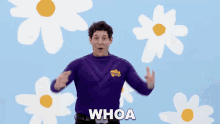 a man in a purple shirt with the word whoa written on the bottom