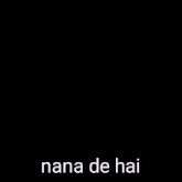 a woman in a striped shirt is taking a selfie with the words nana de hai written on her shirt .