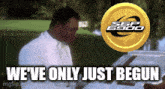 a man in a white suit is standing in front of a sbp logo