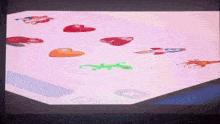 a screen shows a lizard and a rocket among other objects