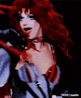 a close up of a woman with red hair and a t4yce tumblr logo