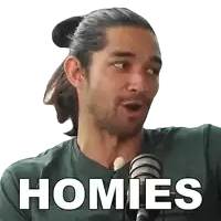 a man in a green shirt is talking into a microphone with the word homies written on the screen