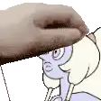 a close up of a person 's hand holding a cartoon character 's head .