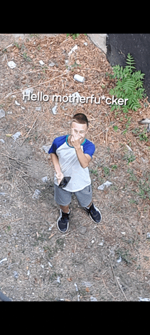 a young man giving the middle finger with the words hello motherfucker written above him