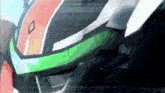 a close up of a robot 's helmet with a green stripe on the side .