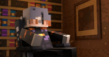 a minecraft character sits in a chair in front of a bookshelf