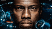 a close up of a man 's face with a screen behind him that says ' a ' on it