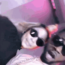 a man and a woman wearing sunglasses are posing for a photo
