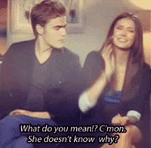 a man and a woman are sitting on a couch and the woman says " what do you mean "
