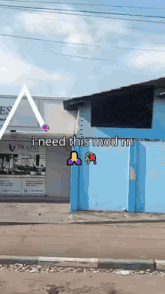 a blue building with a sign that says " pilates " on it