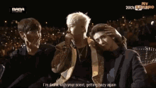 a group of men standing next to each other with the words mama 20th on the bottom