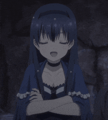 a girl in a blue dress with her eyes closed and her mouth open