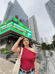 a woman is standing in front of a building with a sign that says lazing fast downloads for content streaming