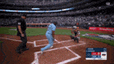 a baseball game is being played in a stadium with an ad for everything on the outfield wall