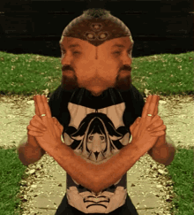 a man with a beard wearing a shirt with a girl on it crosses his arms