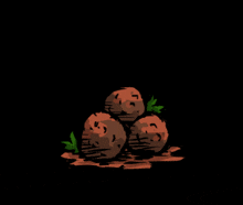 three potatoes are stacked on top of each other in a dark room