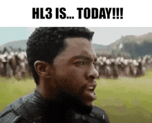 a man is standing in a field with a crowd of people behind him and the words hl3 is today