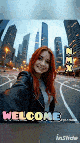 a woman taking a selfie in front of a city skyline with the words welcome below her
